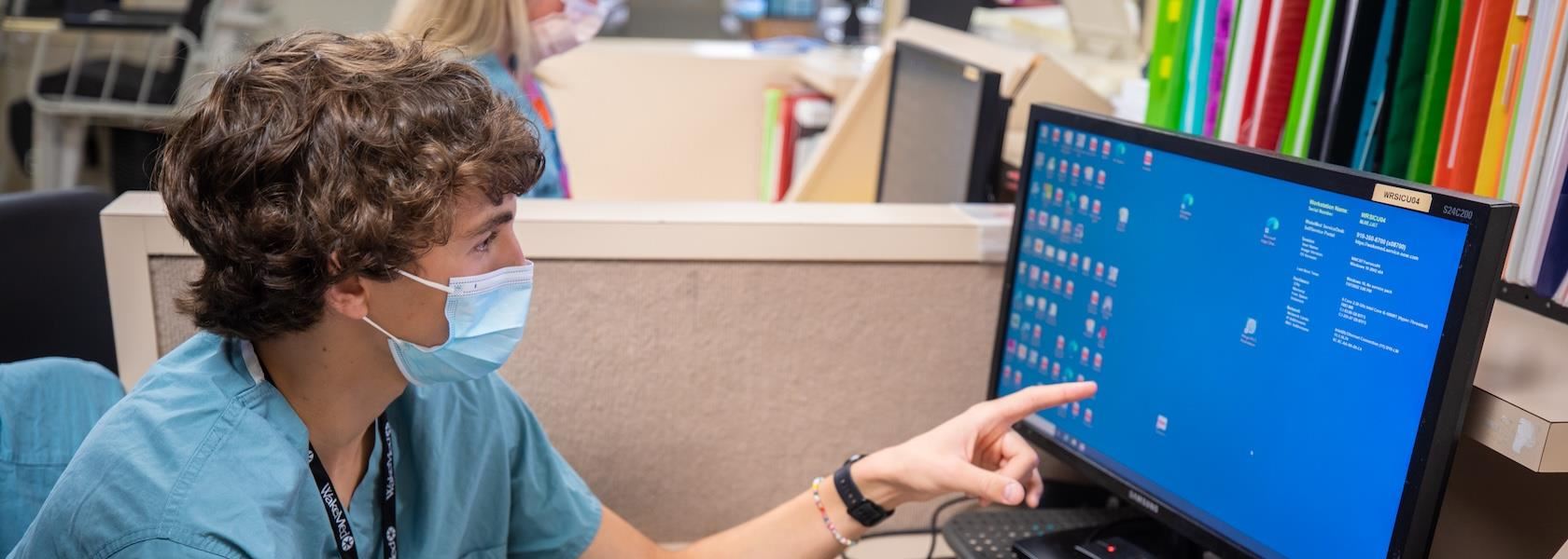 An early career academy student take part in a work study and WakeMed hospital.